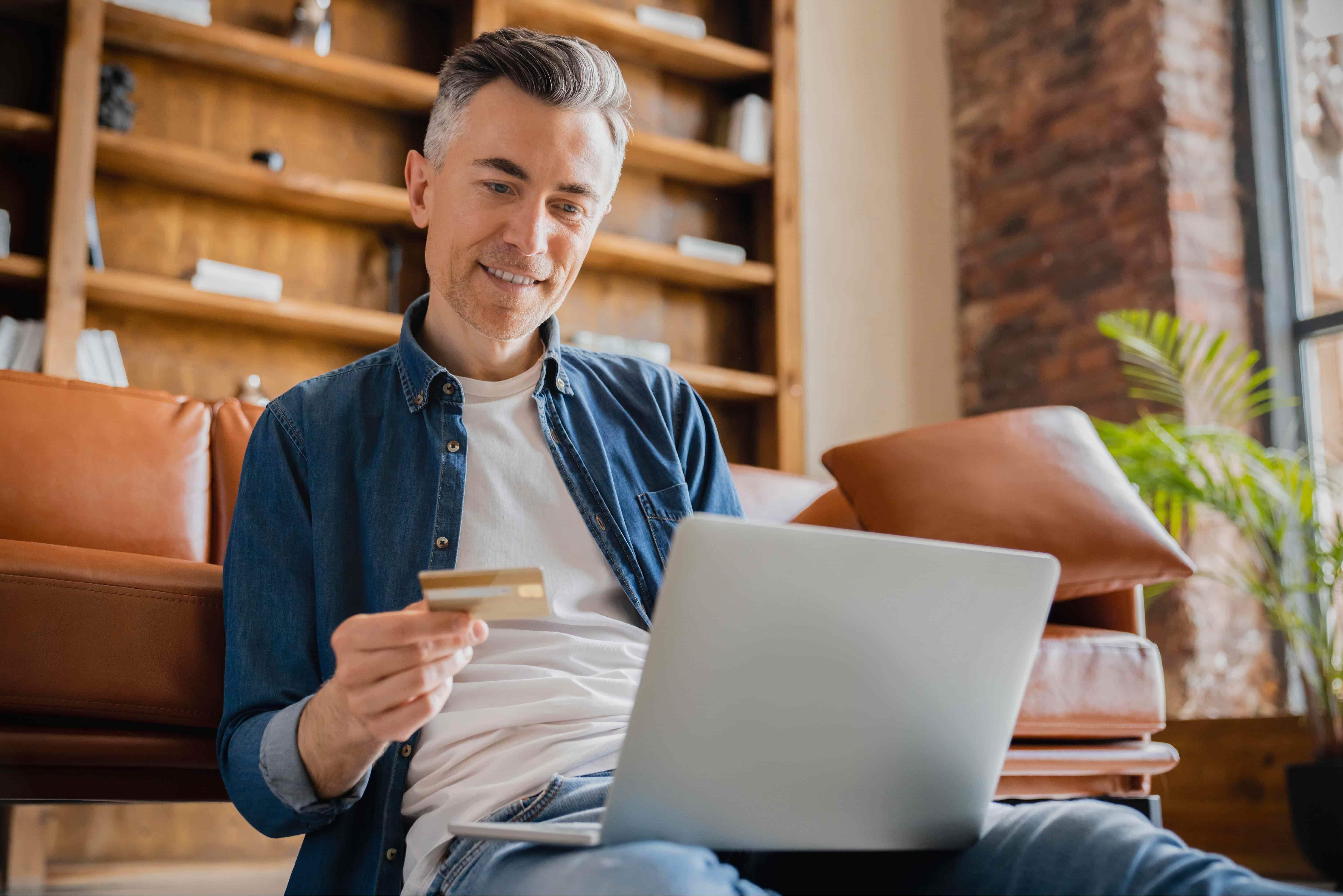 A man paying online with his card.